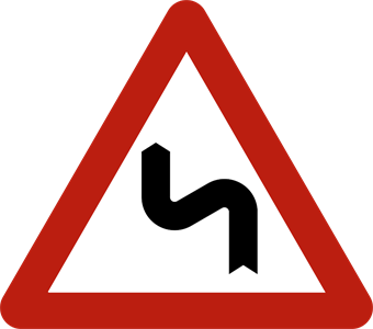 Signal de danger : double virage ou succession de virages dont le premier est à gauche