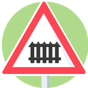 Signal de danger : passage à niveau avec barrières