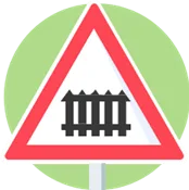 Signal de danger : passage à niveau avec barrières